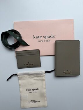 kate spade card holder & passport wallet with gold logo in oyster shell color